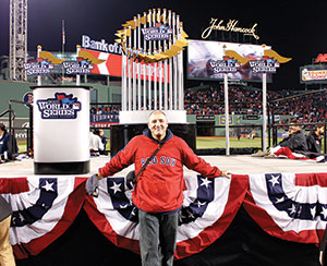 Sean Sullivan on the field in front of the World Series stage.