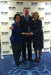 National School Boards Association President David Pickler presents the Shannon  Award for Excellence to MA Association of School Committees 2014 President Ann  Marie Cugno of Medford (left) and MA Association of School Committees 2013  President Mary Jo Rossetti of Somerville (right).